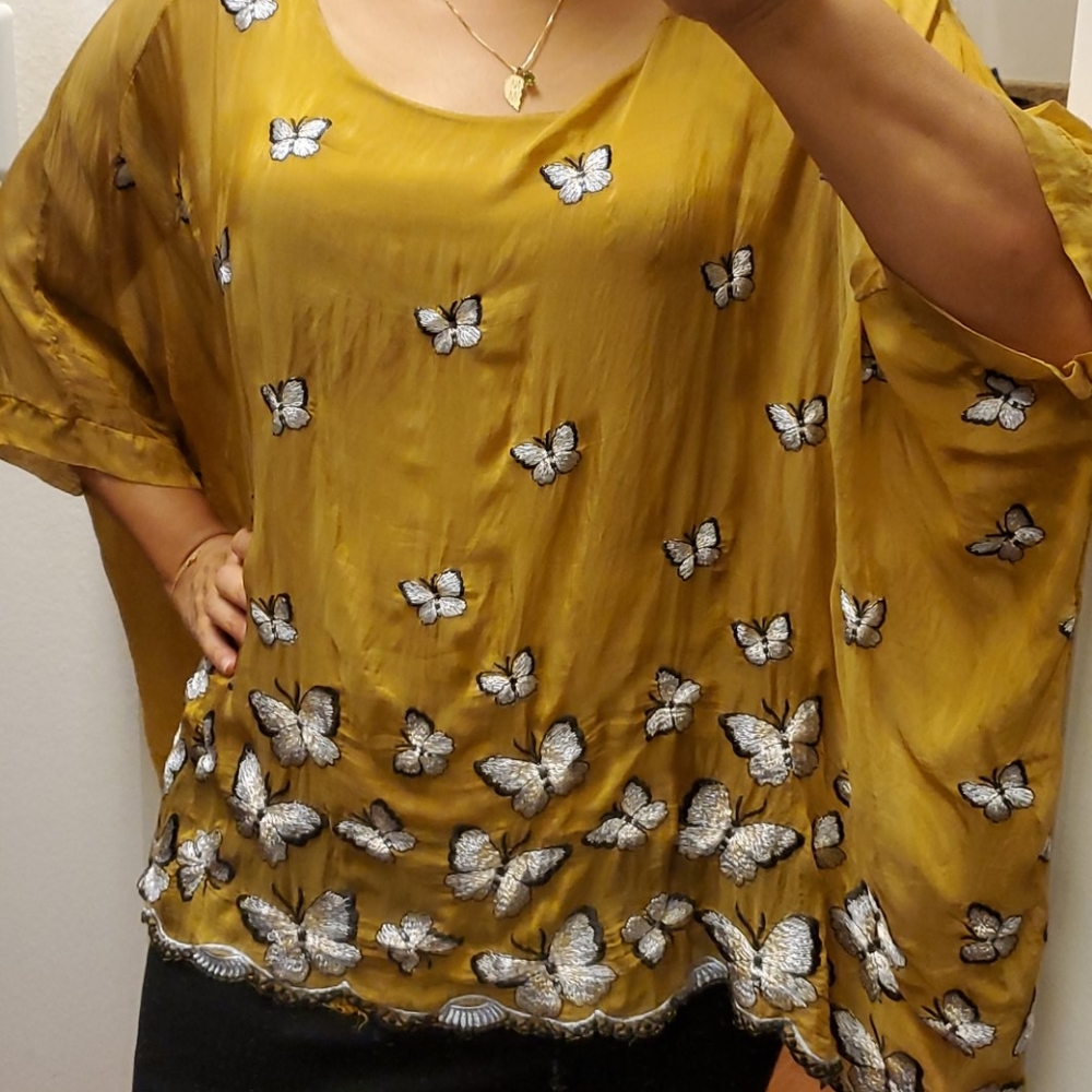 Sleeveless tank with sheer overlay